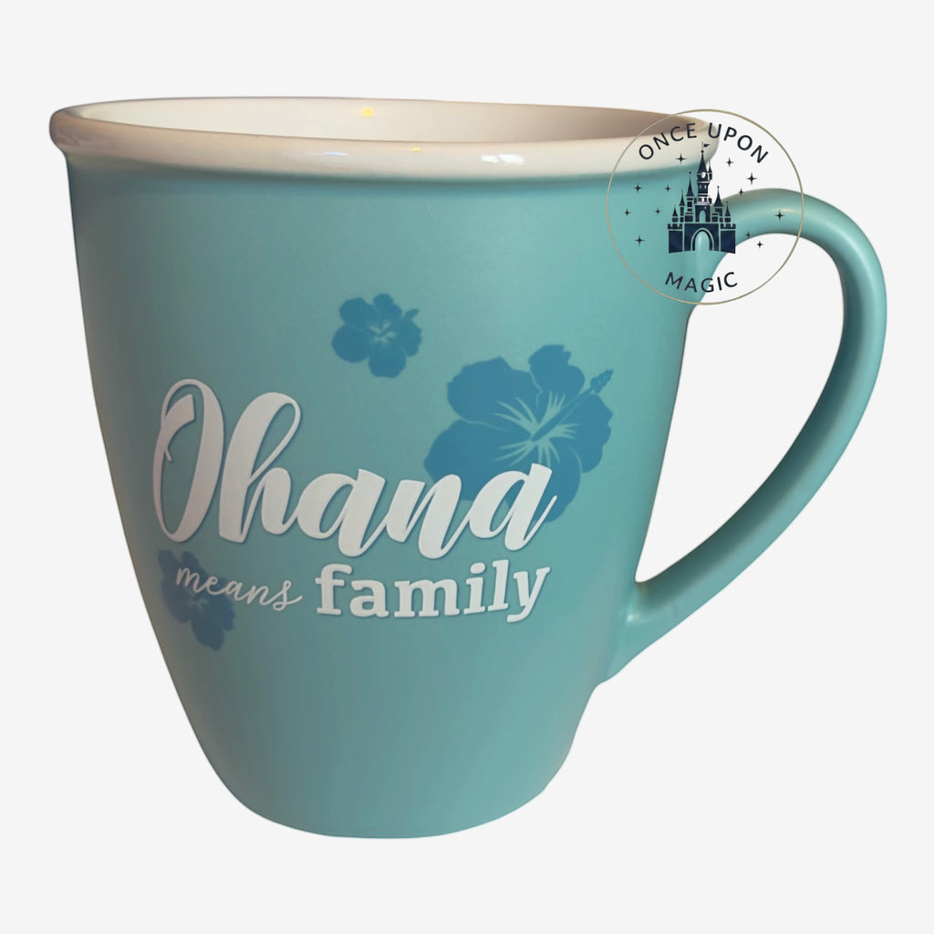 Once Upon Magic teal ceramic coffee mug featuring hibiscus flowers and the Ohana means family quote