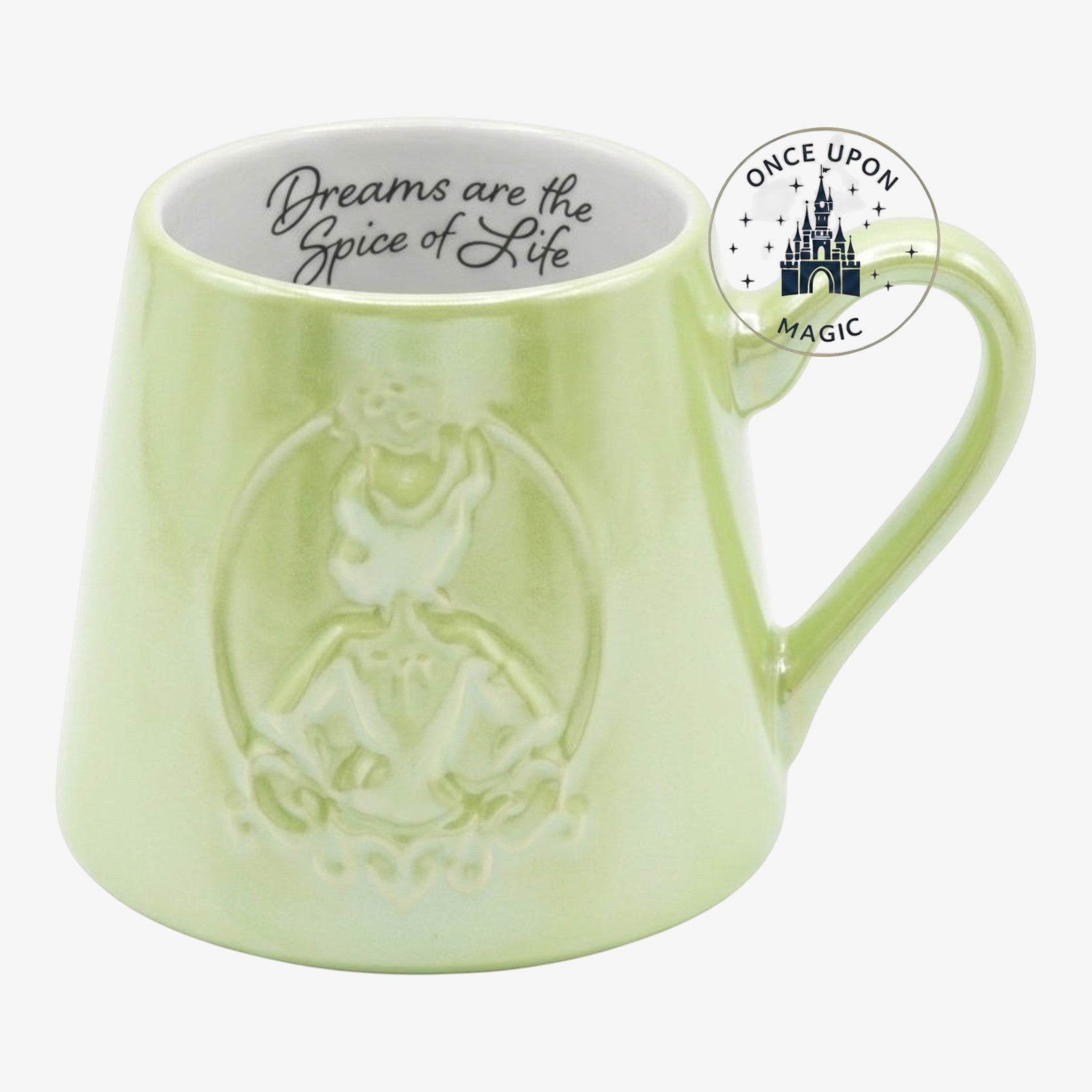 Once Upon Magic Tiana ceramic mug in light green with an embossed crown and Dreams Are the Spice of Life quote inside.