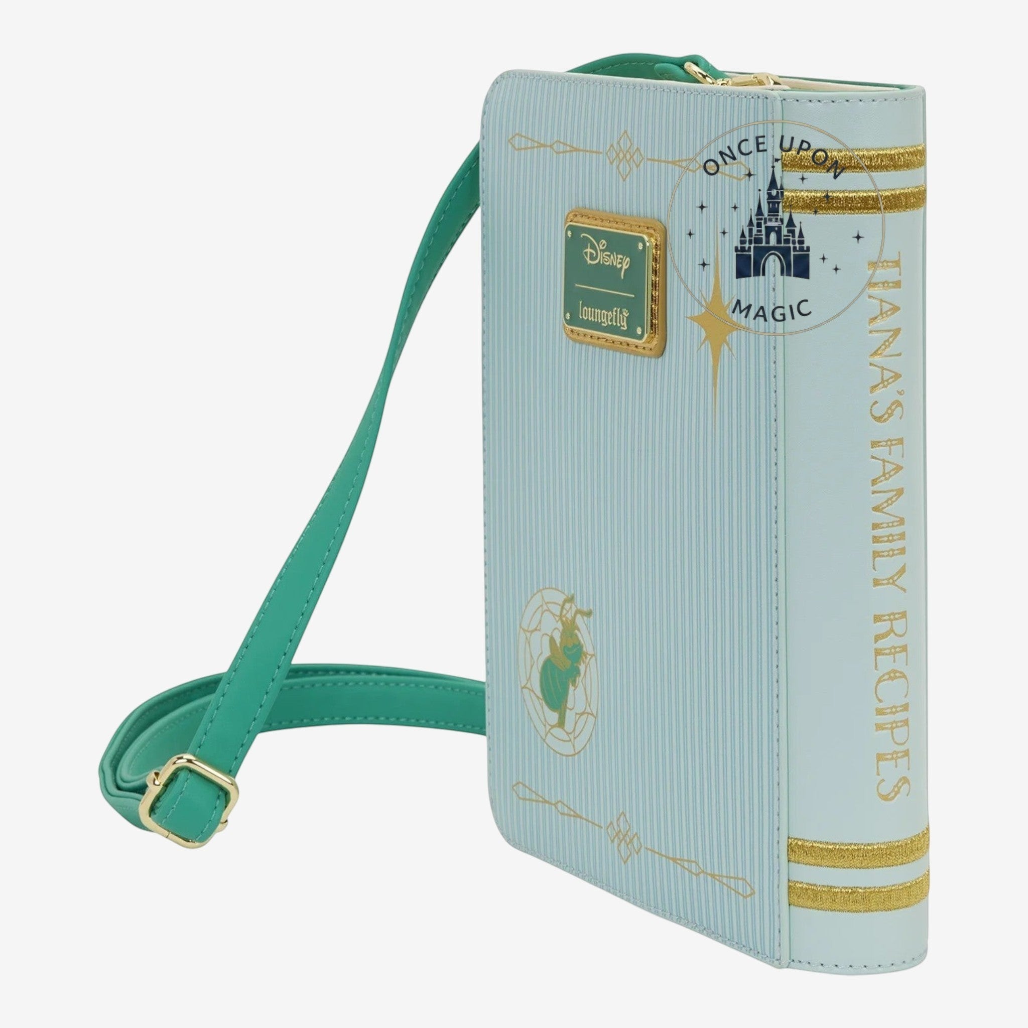 Once Upon Magic light blue faux leather crossbody bag designed as a storybook with Tiana's Family Recipes title and gold trim.