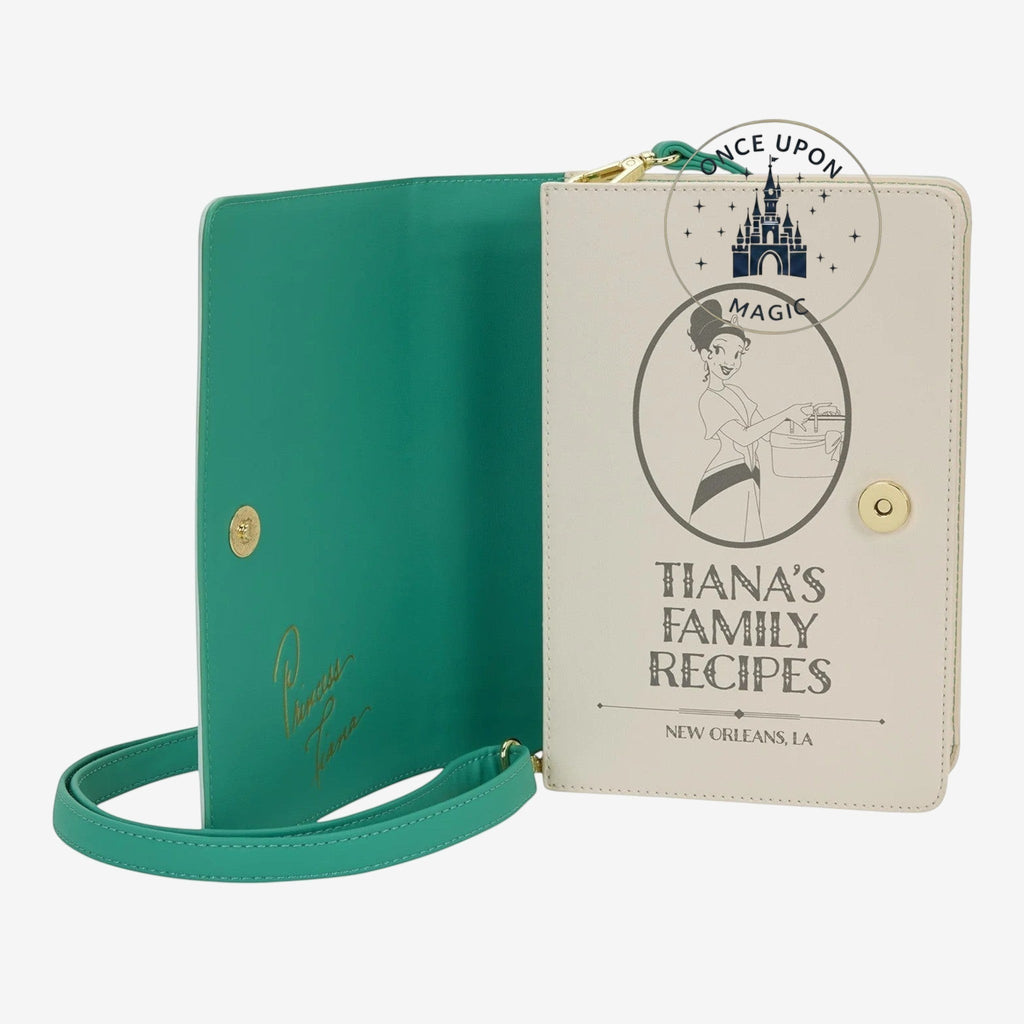 Once Upon Magic Tiana's Family Recipes book crossbody bag in cream and teal faux leather with Tiana illustration and gold trim.