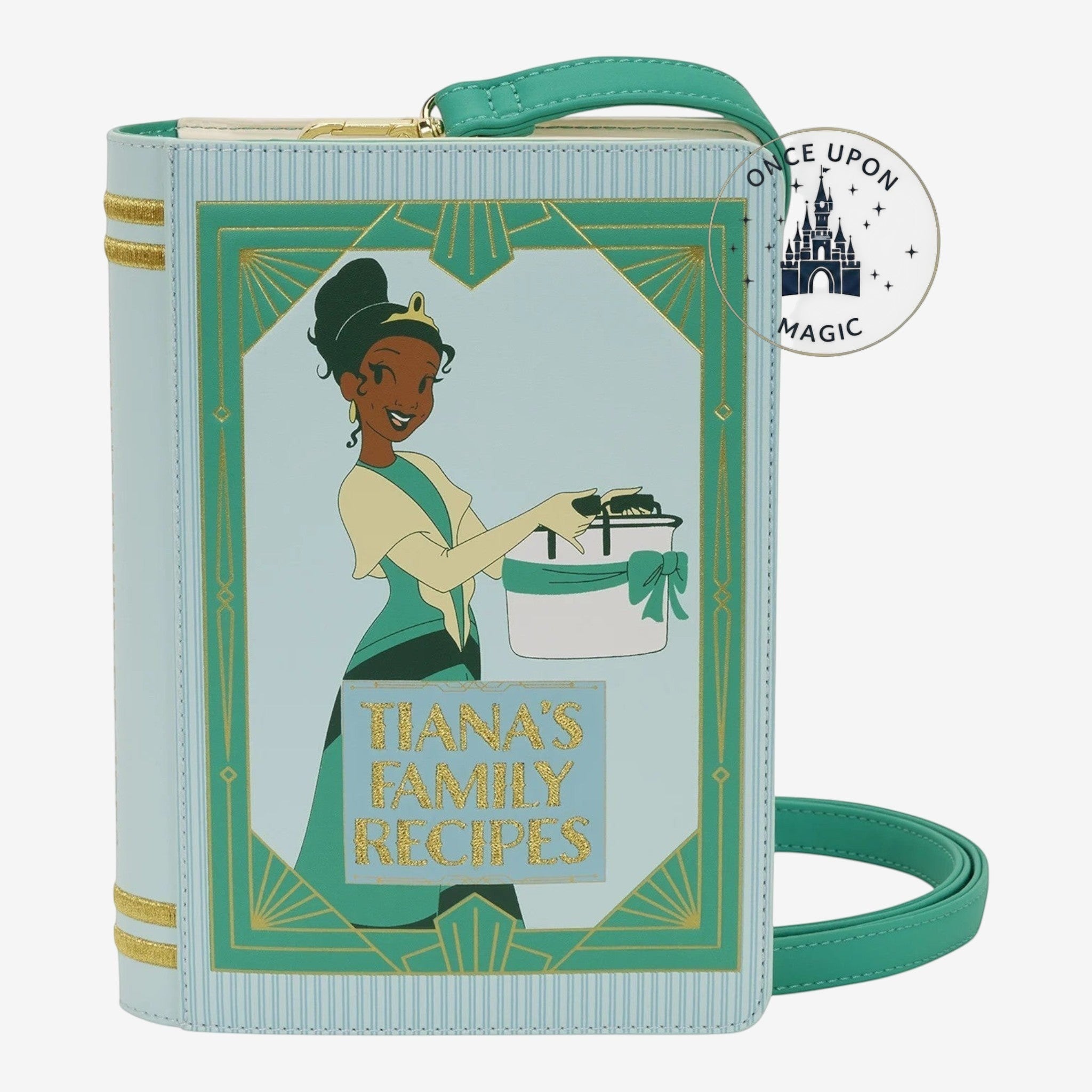 Once Upon Magic light blue faux leather crossbody bag designed as a storybook with Princess Tiana illustration and "Tiana's Family Recipes" title.