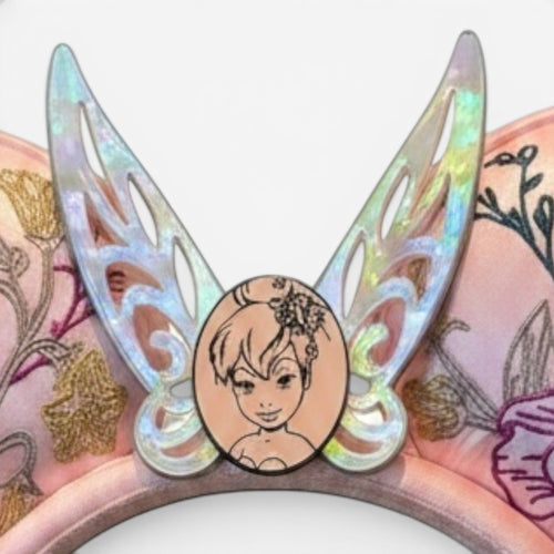 Once Upon Magic pink and green Tink ears with iridescent wings and embroidered floral details. Features a Tink portrait.