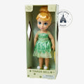 Once Upon Magic Tinker Bell doll in green dress with glittery sleeves and wings, blonde bun, blue eyes, and pom-pom sandals.