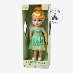 Once Upon Magic Tinker Bell doll in green dress with glittery sleeves and wings, blonde bun, blue eyes, and pom-pom sandals.