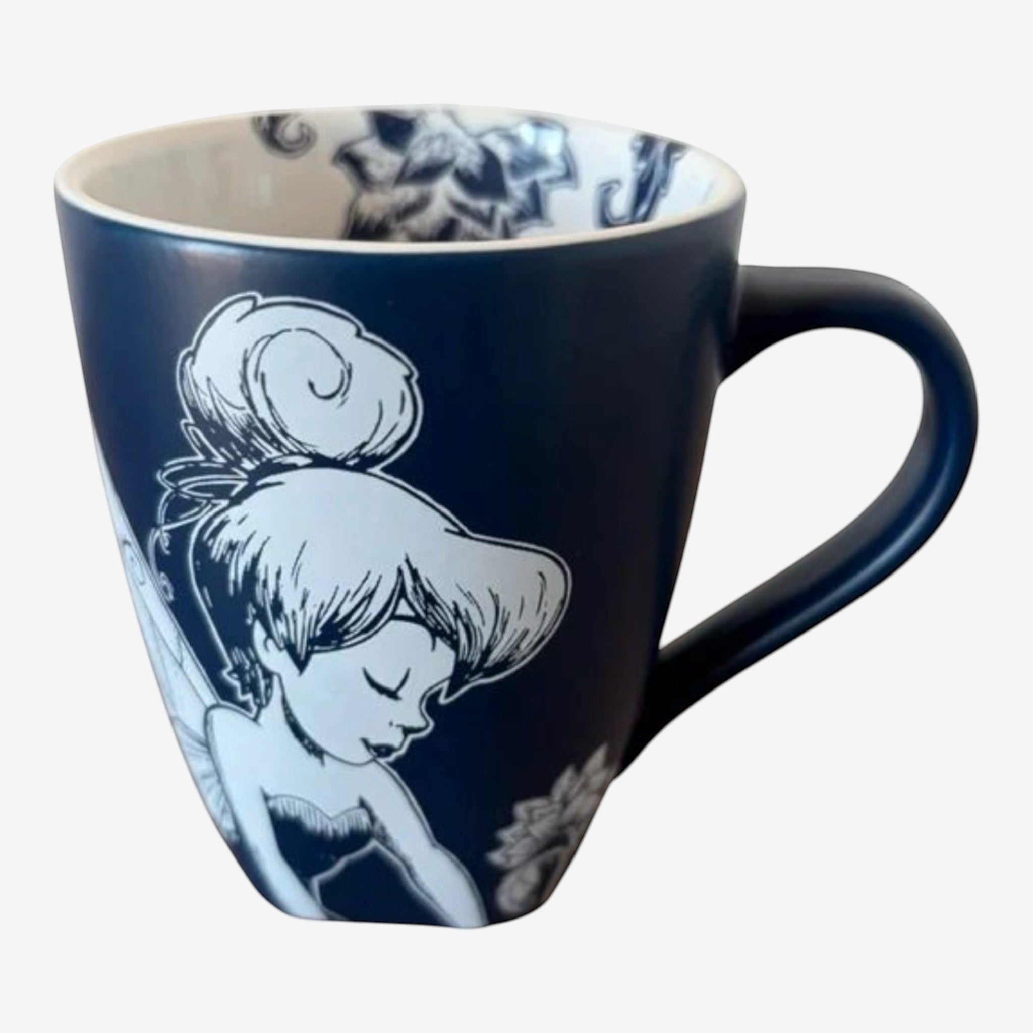 Once Upon Magic navy ceramic mug with black and white illustration of Tinker Bell surrounded by flowers and butterflies.