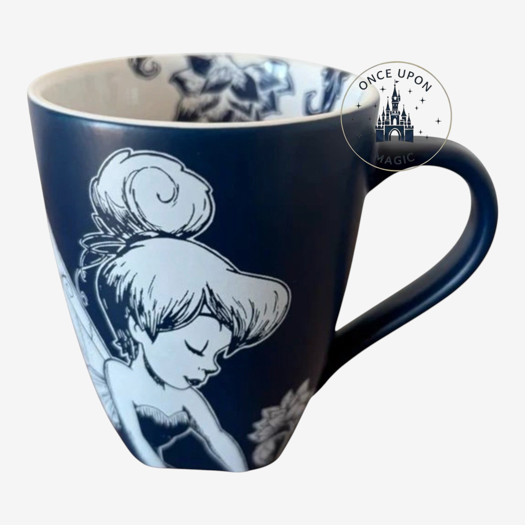 Once Upon Magic navy ceramic mug with black and white illustration of Tinker Bell surrounded by flowers and butterflies.