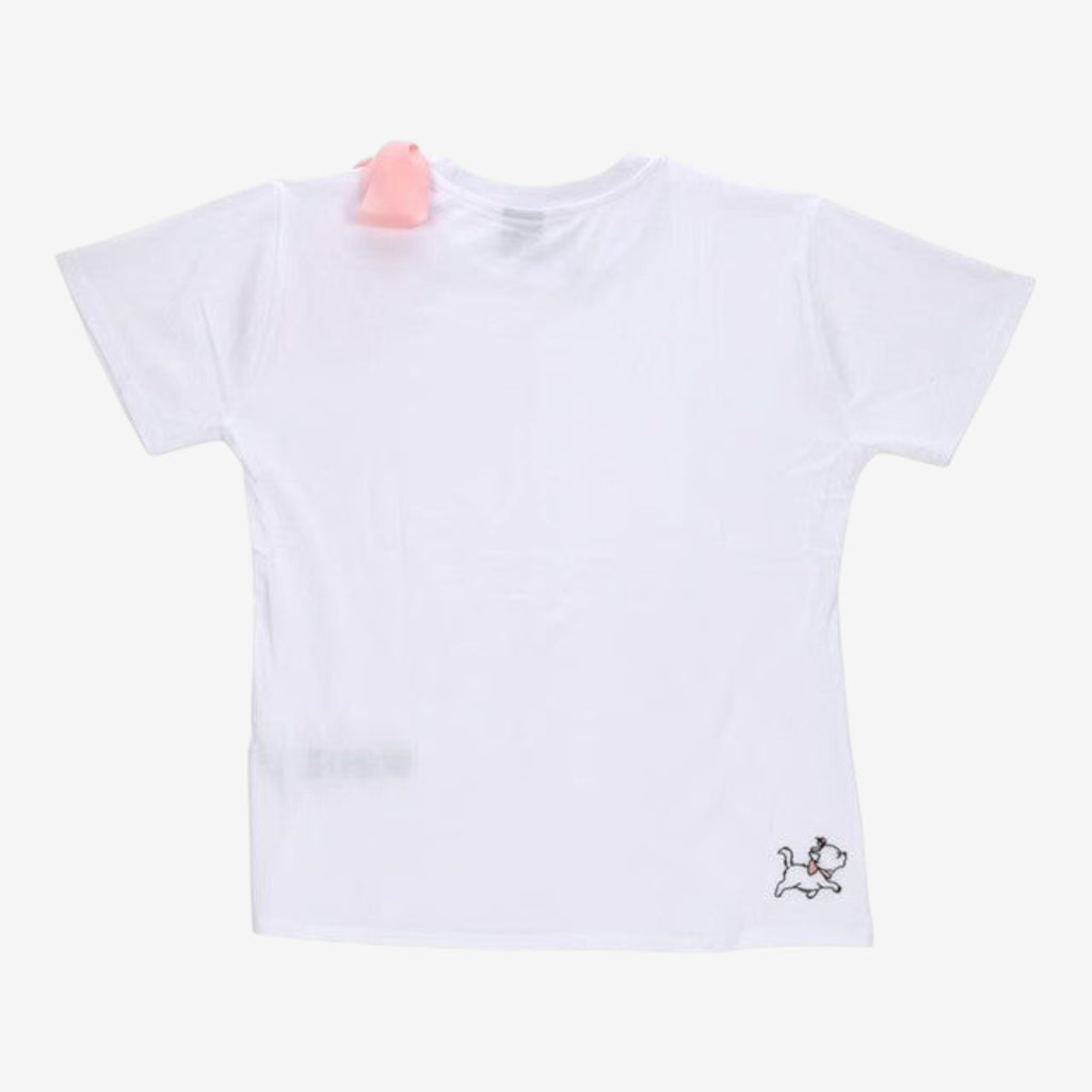 Once Upon Magic white cotton t-shirt with pink chiffon bow detail on left shoulder and embroidered dog graphic on back.