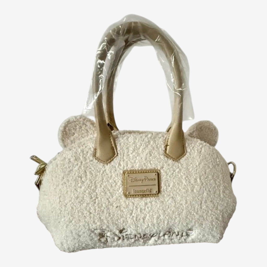 Once Upon Magic cream sherpa Winnie the Pooh mini duffel bag with bear ears and embroidered Disneyland Paris logo.