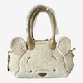 Once Upon Magic Winnie the Pooh sherpa mini duffel bag with embroidered face and ears, beige handles.