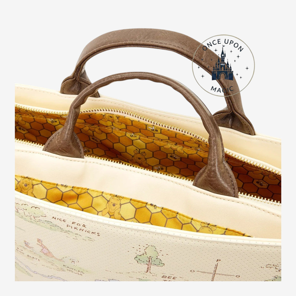 Once Upon Magic Winnie the Pooh Hundred Acre Wood tote bag with map exterior and honeycomb lining.