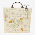 Once Upon Magic Winnie the Pooh Hundred Acre Wood tote bag with map design, Pooh, Piglet, Tigger pins, and brown handles.