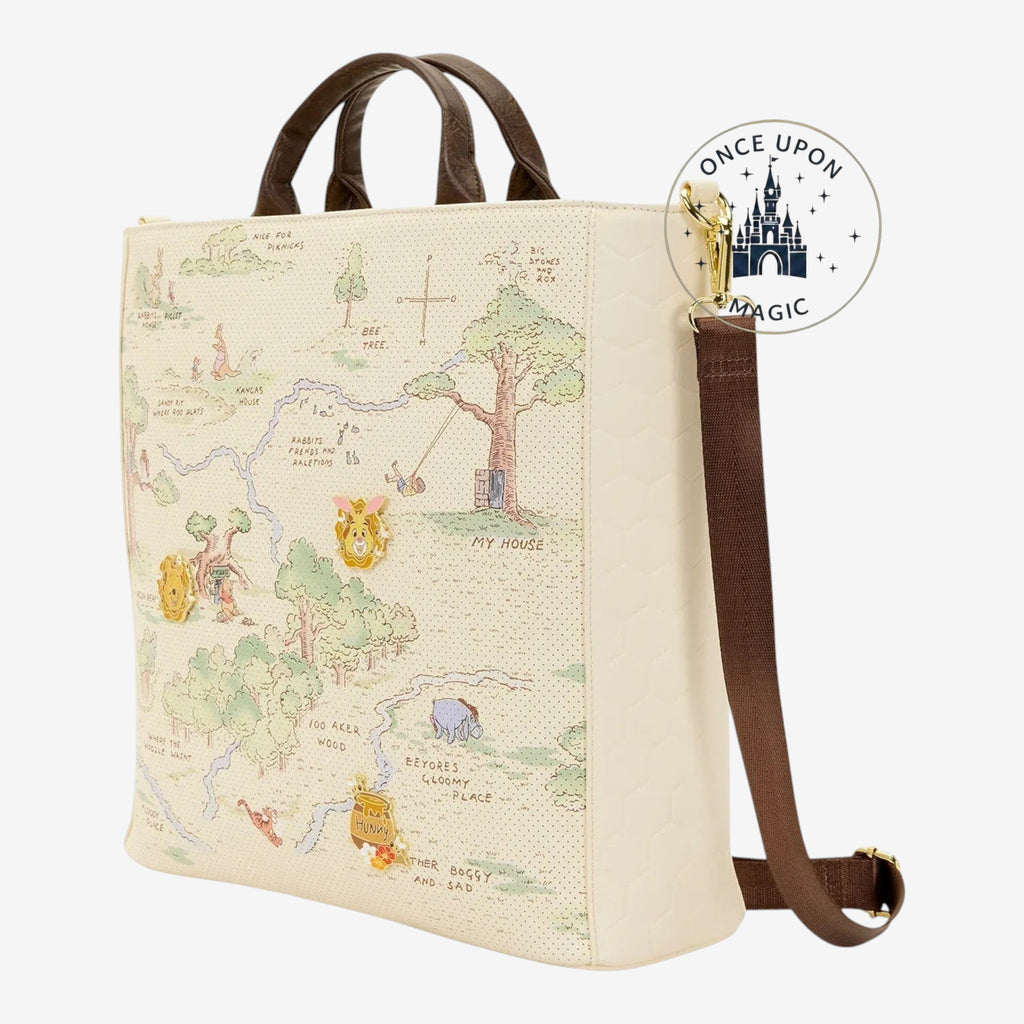 Once Upon Magic Winnie the Pooh Hundred Acre Wood tote bag with map print, character pins, and brown handles.