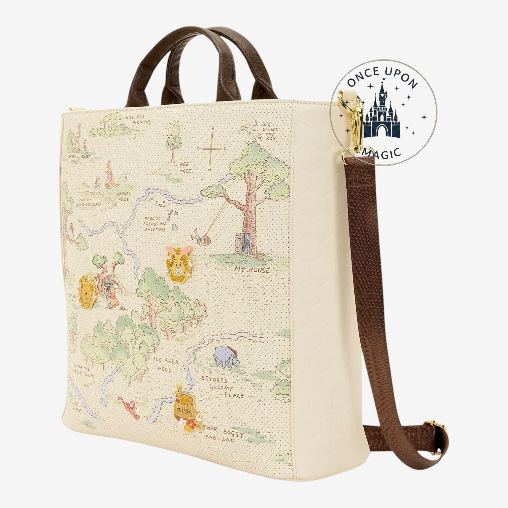 Once Upon Magic Winnie the Pooh Hundred Acre Wood tote bag with map print, character pins, and brown handles.
