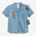 Once Upon Magic Winnie the Pooh and friends embroidered light blue denim short sleeve shirt with yellow buttons.