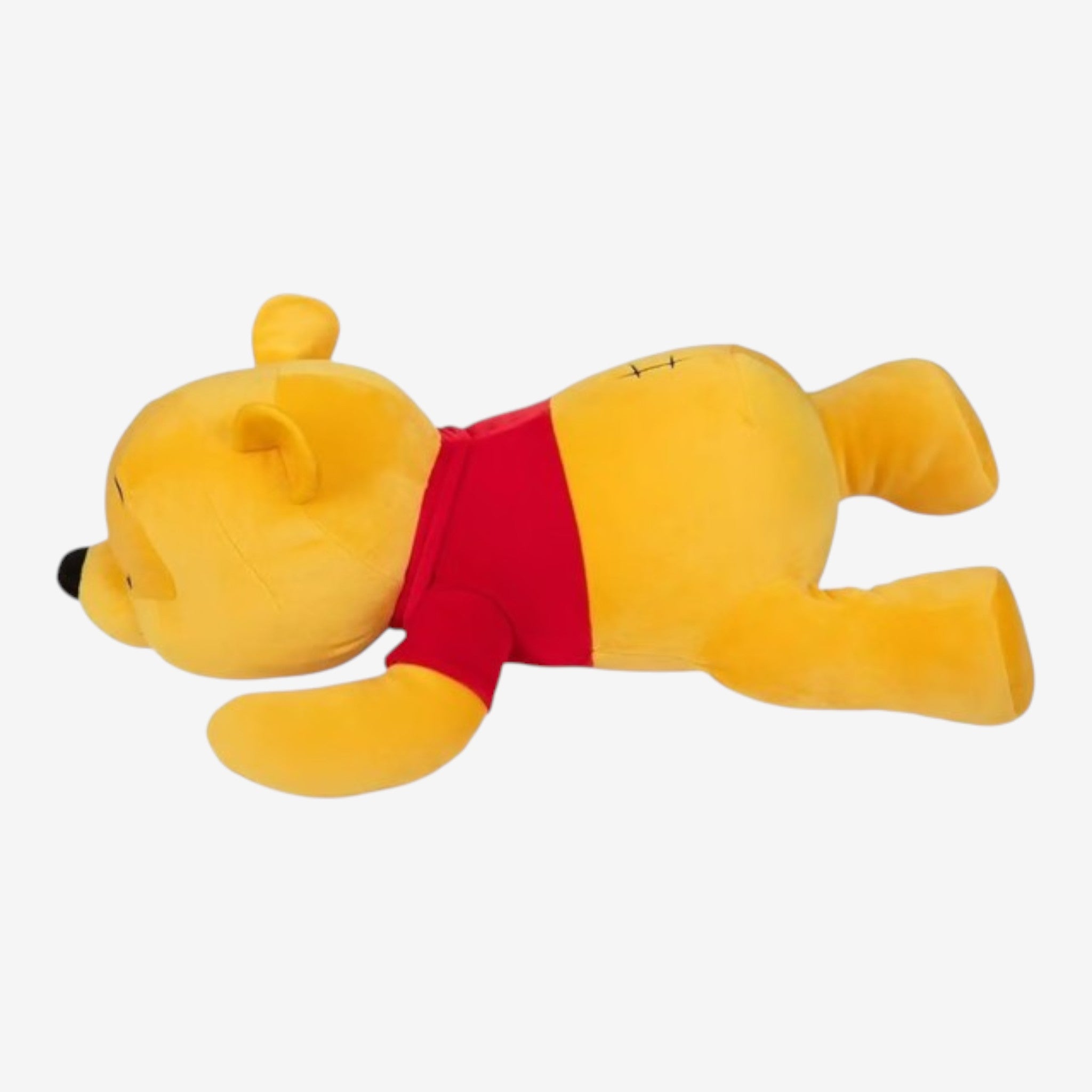 Once Upon Magic Winnie the Pooh plush toy in soft yellow fabric with a red shirt and stitched details.