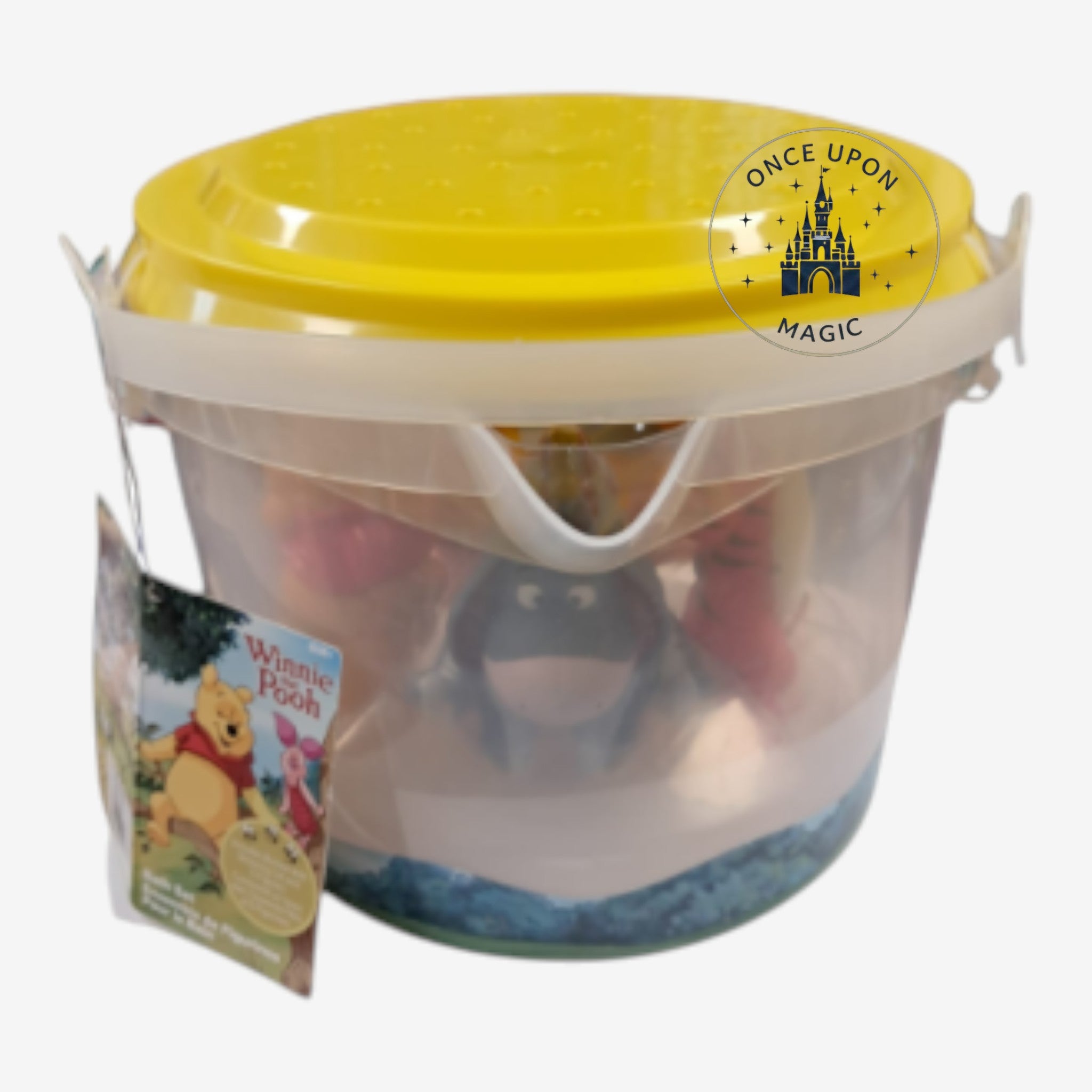 Once Upon Magic Winnie the Pooh character figurine set in a clear plastic storage bucket with a yellow lid.