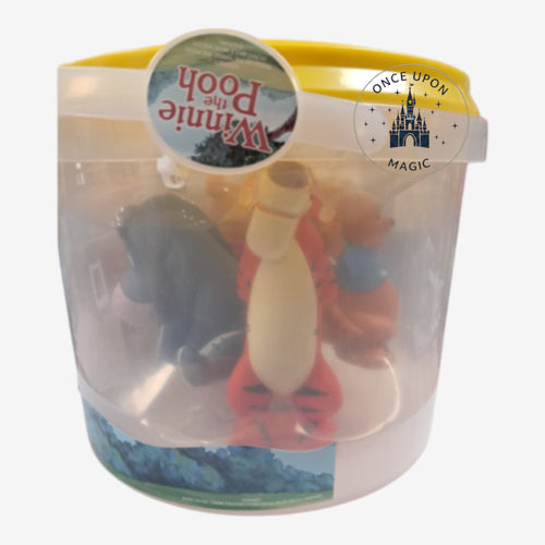 Once Upon Magic Winnie the Pooh character figurine set inside a clear plastic storage bucket with a yellow lid