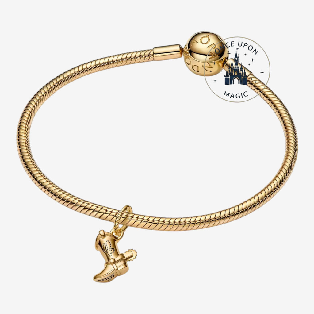 Once Upon Magic gold-tone charm bracelet with a Woody boot charm engraved with Andy.