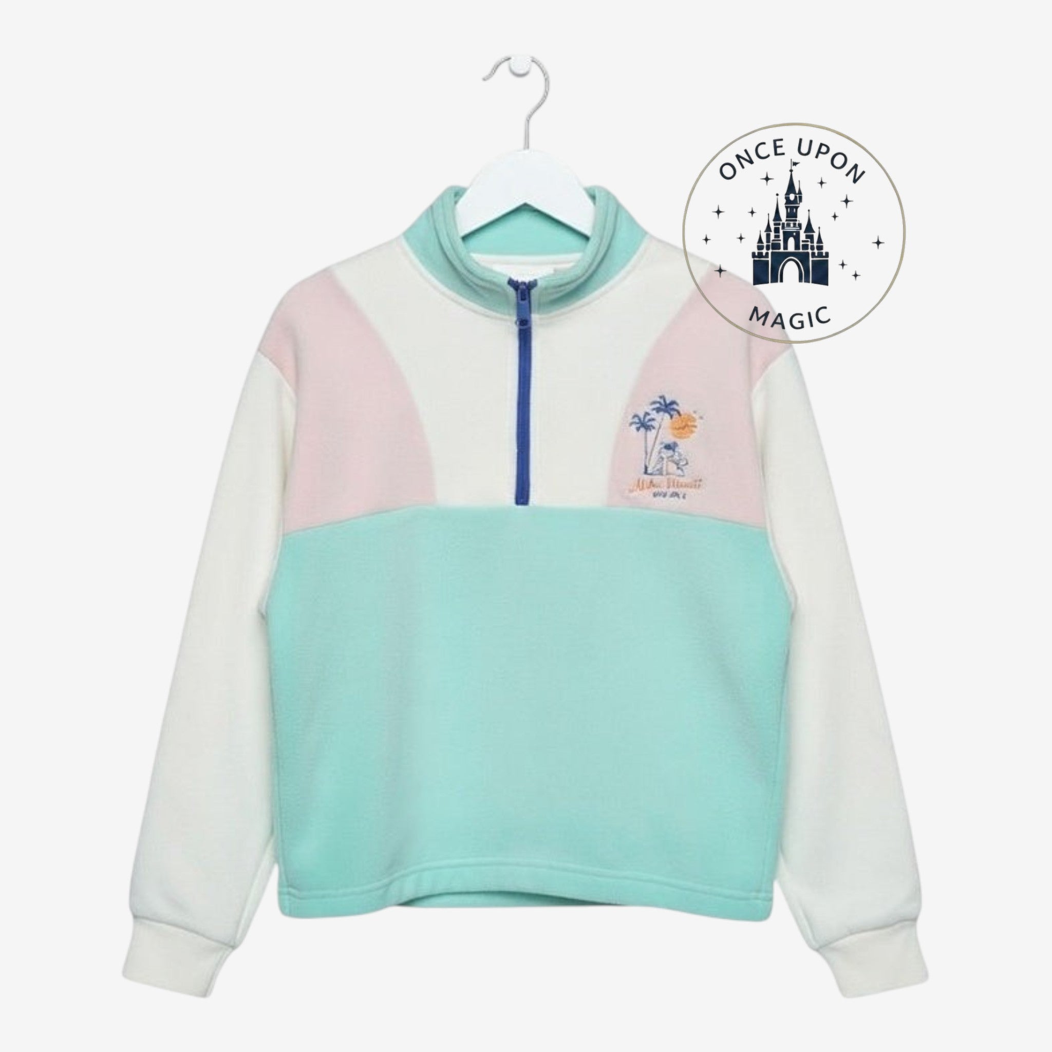 Once Upon Magic youth quarter zip pullover in pastel mint, blush pink, and white with tropical graphic and ribbed cuffs
