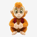 Once Upon Magic Abu plush toy, orange monkey with golden-rimmed eyes and red vest, soft and huggable.