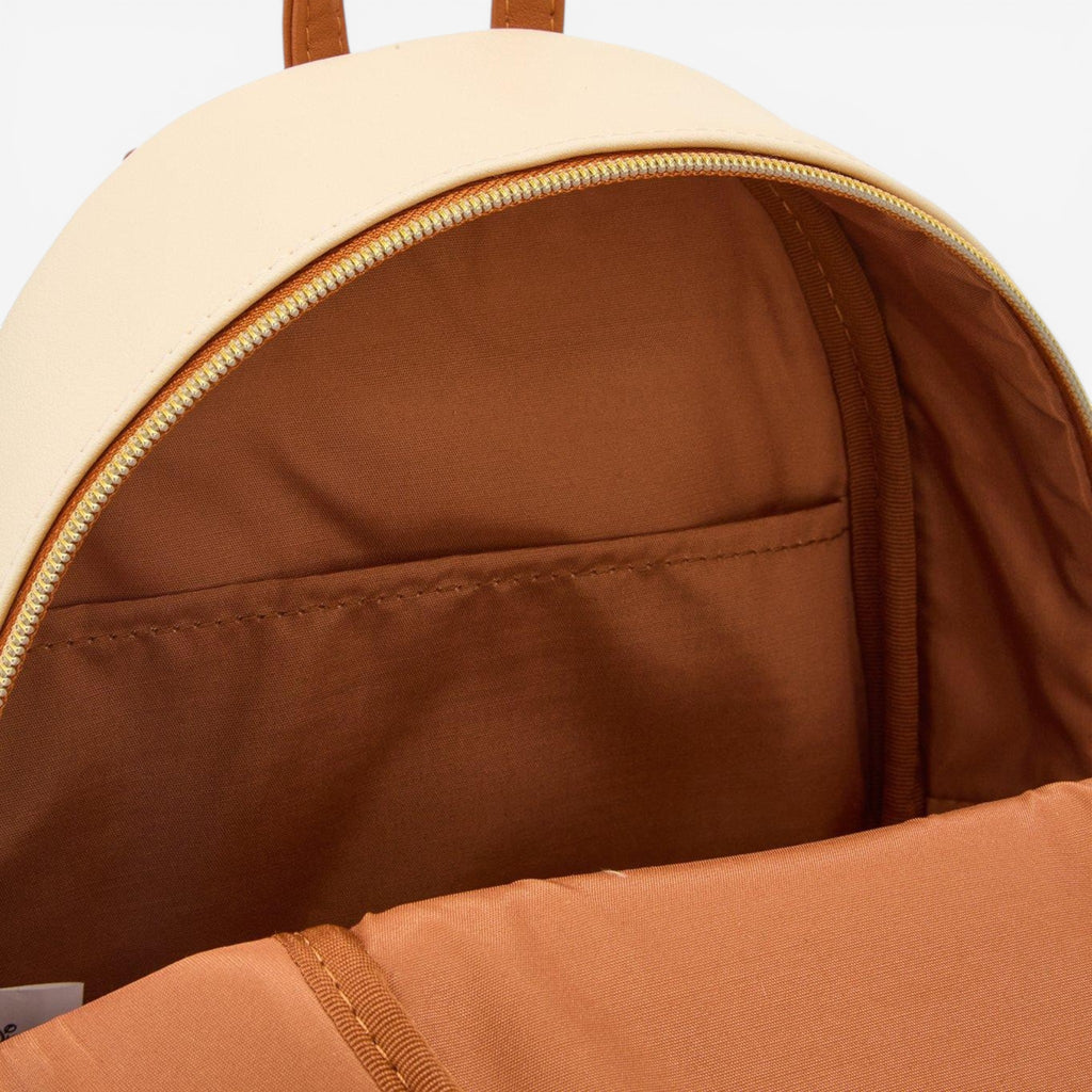 Once Upon Magic mini backpack inspired by Beauty and the Beast, featuring Belle and a castle design. Cream and brown faux leather.
