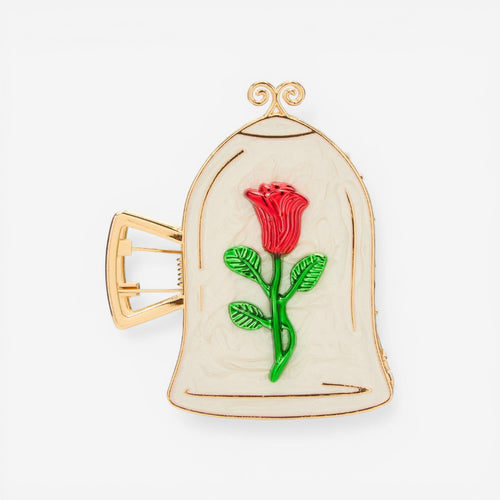 Once Upon Magic Beauty and the Beast rose claw hair clip, featuring a red rose under a glass dome on an ivory background with gold trim.
