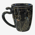 Once Upon Magic black ceramic mug featuring a white outline of Duchess from The Aristocats looking at the Eiffel Tower in gold.