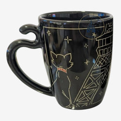 Once Upon Magic black ceramic mug featuring a white outline of Duchess from The Aristocats looking at the Eiffel Tower in gold.