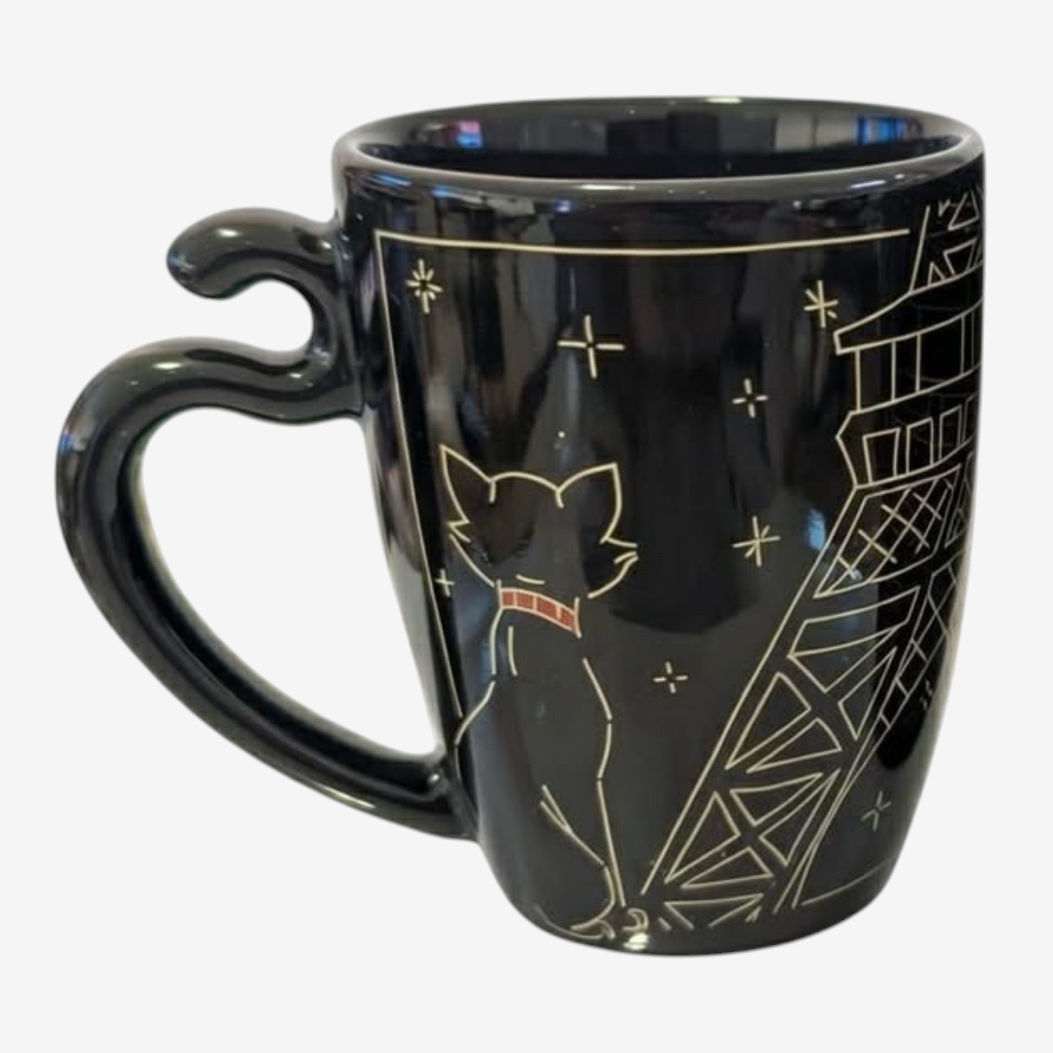 Once Upon Magic black ceramic mug featuring a white outline of Duchess from The Aristocats looking at the Eiffel Tower in gold.