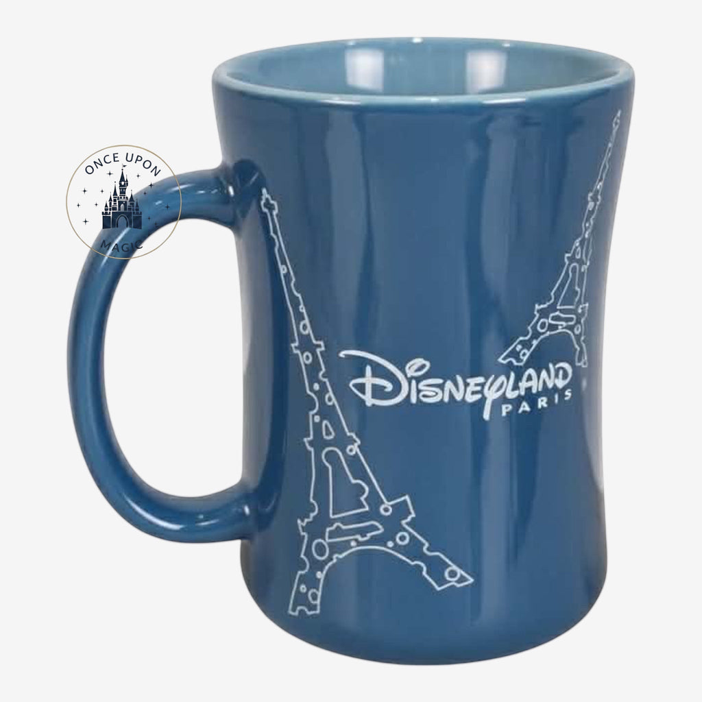 Once Upon Magic blue ceramic mug featuring Eiffel Tower outlines and Disneyland Paris logo. Interior is light blue.