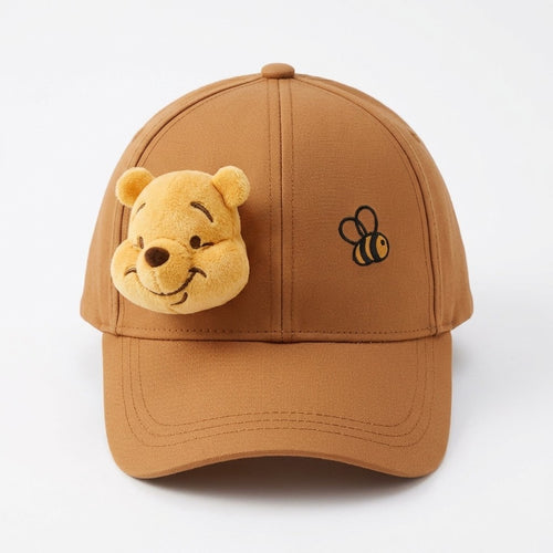 Once Upon Magic brown cotton baseball cap with 3D Winnie the Pooh face and embroidered bee detail.