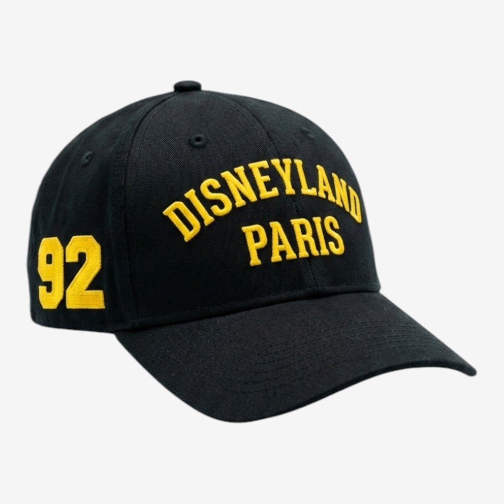 Casquette noire Once Upon Magic avec broderie jaune "Disneyland Paris" et le chiffre "92" sur le côté.