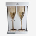 Once Upon Magic set of 2 champagne flutes in champagne gold glass with delicate rose and 'La Belle et la Bête' etching.