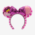 Once Upon Magic Cheshire Cat headband with pink and white striped fuzzy ears and a sparkly purple sequin bow.