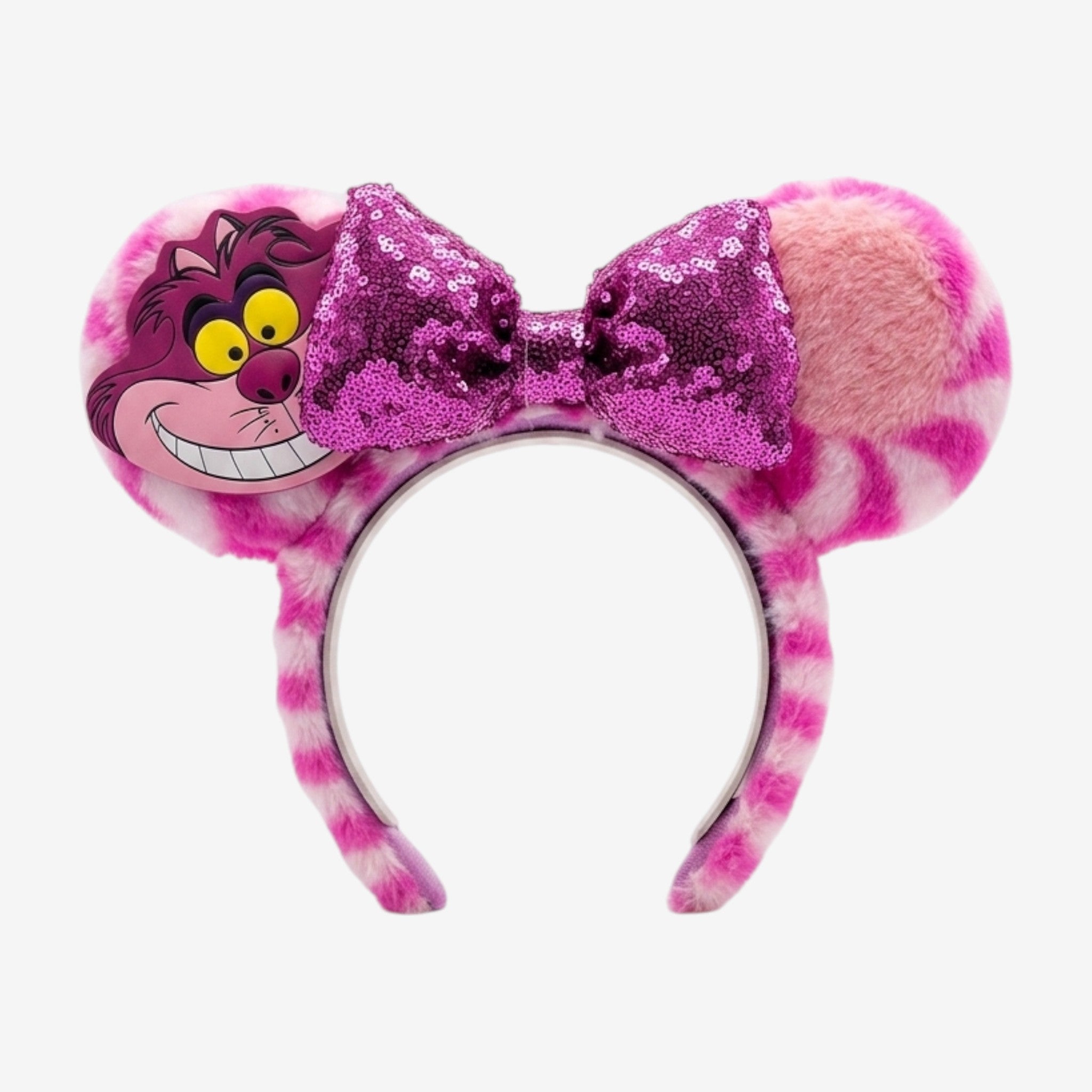 Once Upon Magic Cheshire Cat headband with pink and white striped fuzzy ears and a sparkly purple sequin bow.