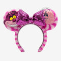 Once Upon Magic Cheshire Cat headband with pink and white striped fuzzy ears and a sparkly purple sequin bow.