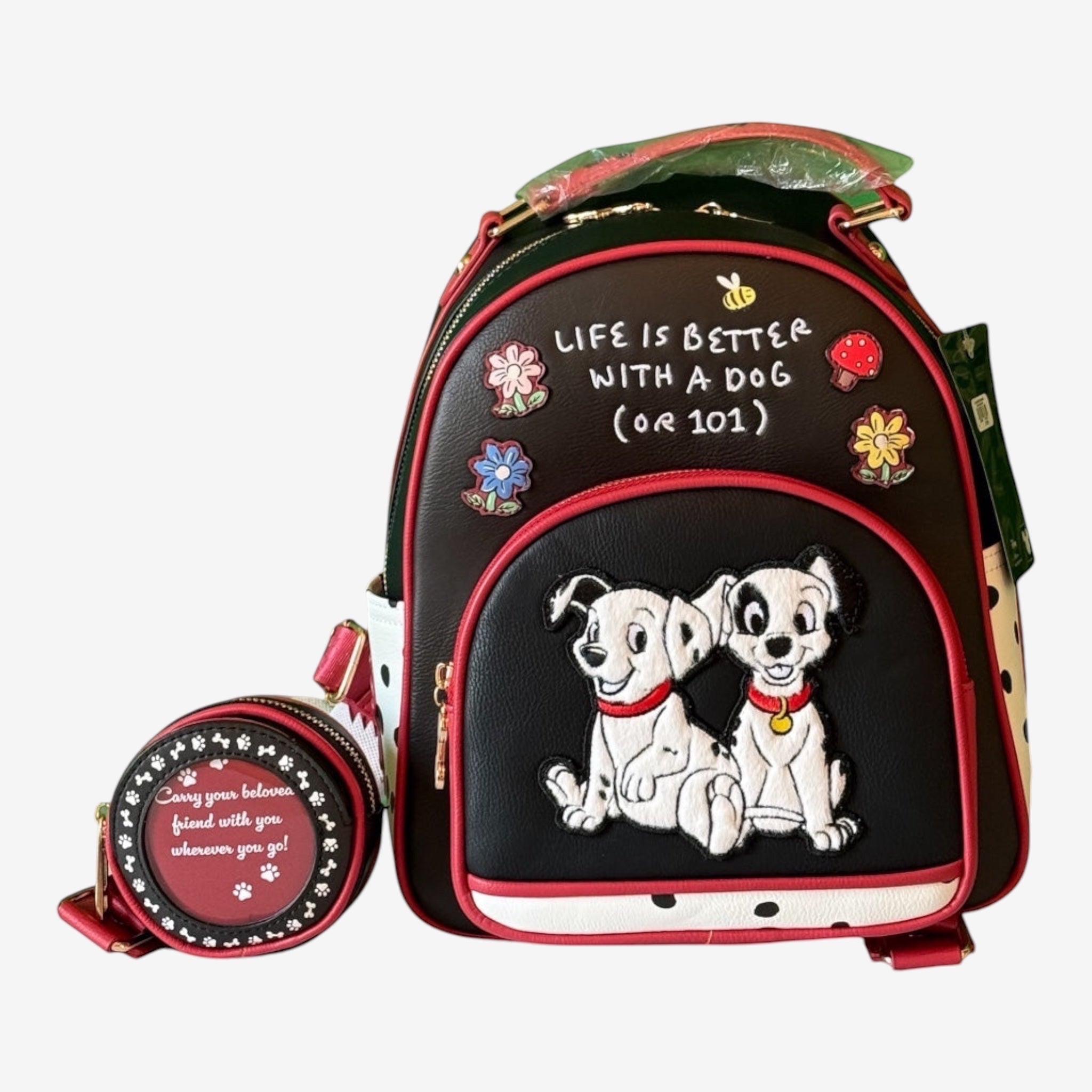 Once Upon Magic black faux leather backpack with two Dalmatians, quote, and polka dots. Includes matching coin purse.
