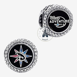 Once Upon Magic sterling silver charm with Disney Adventure World logo and compass design, encrusted with crystals.