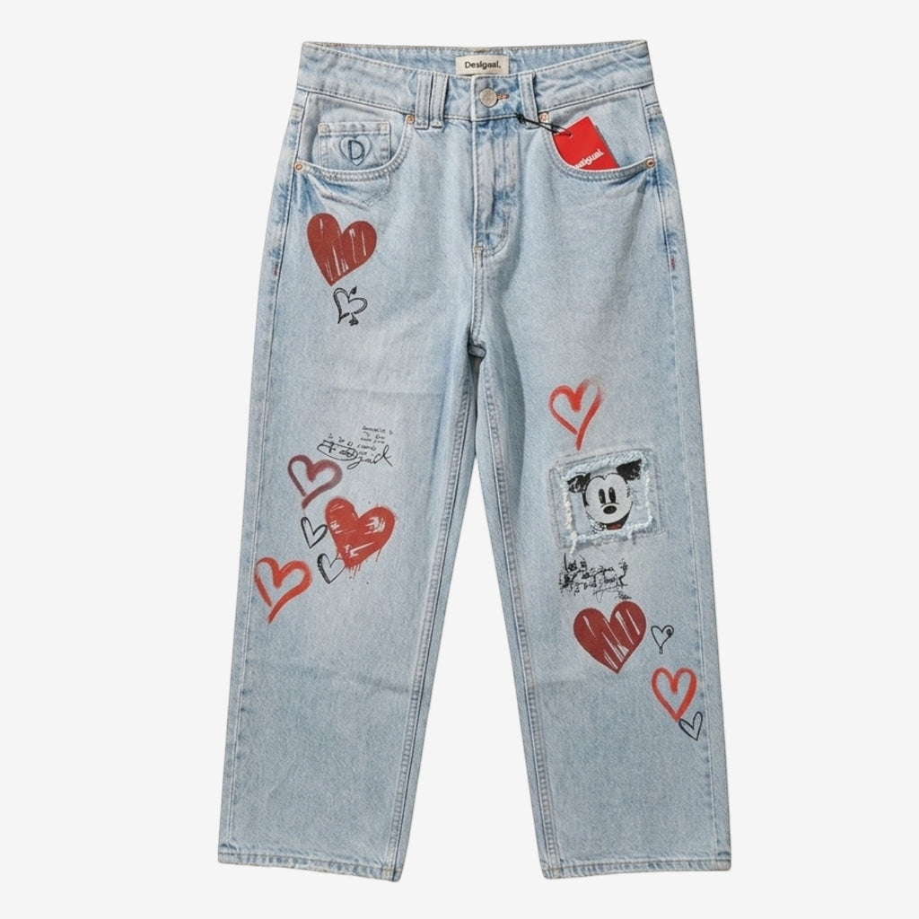 Once Upon Magic light wash denim jeans with red heart prints and a Mickey Mouse patch. Straight leg, mid-rise.