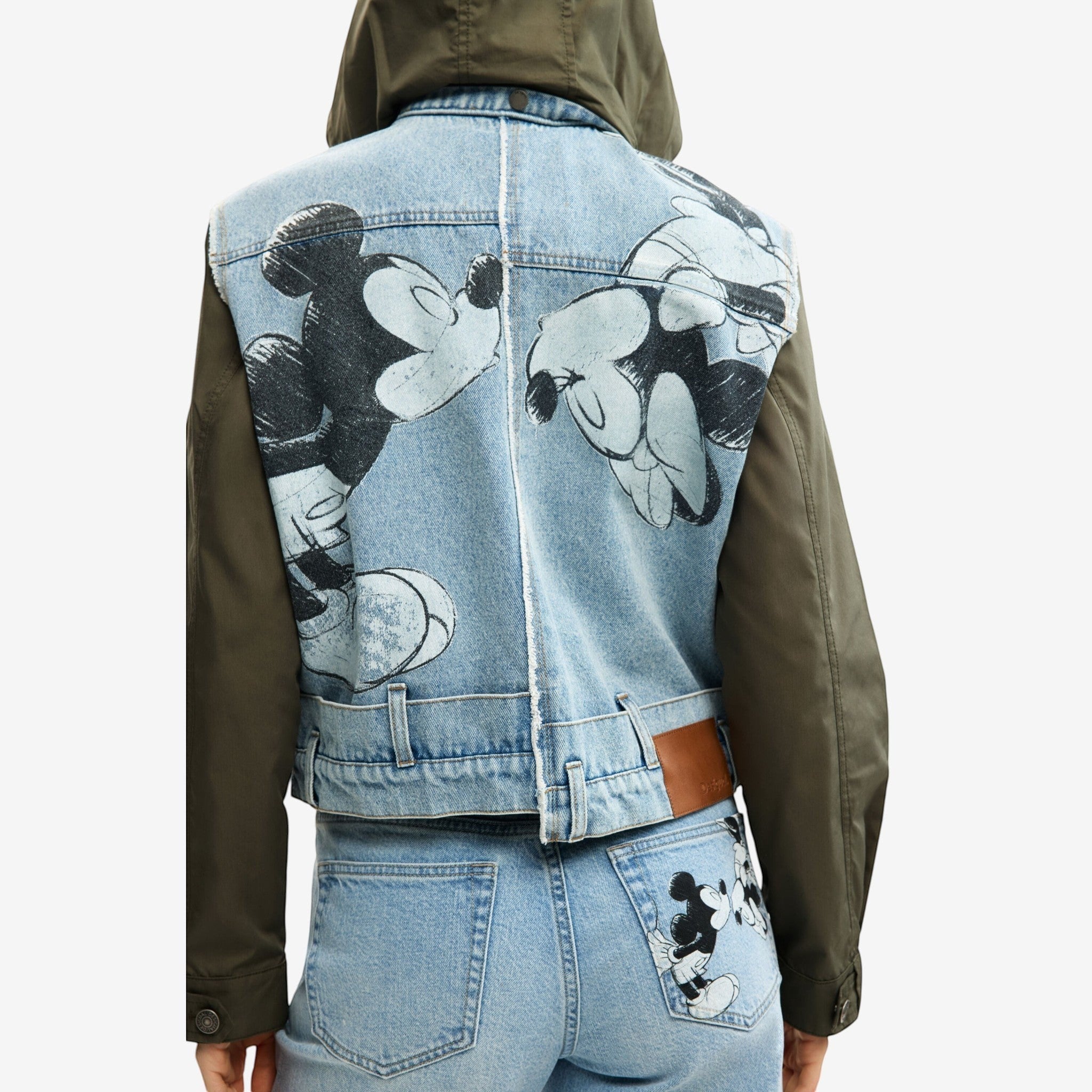Once Upon Magic denim jacket with khaki sleeves, featuring a large graphic print of Mickey Mouse on the back.