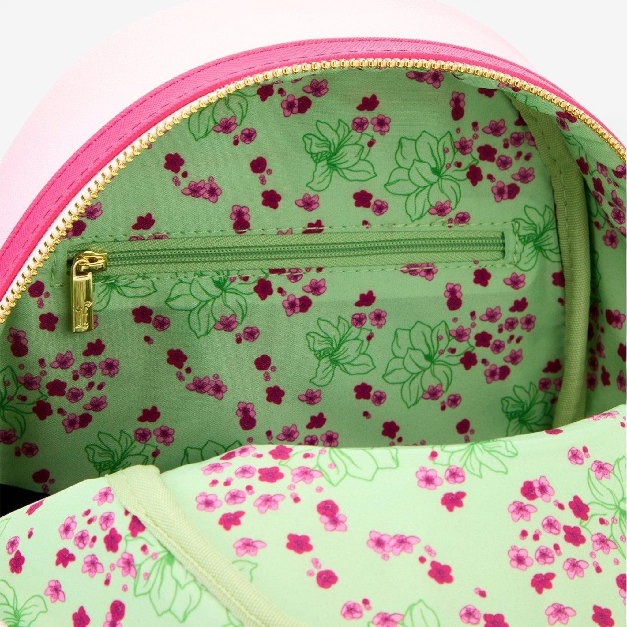 Once Upon Magic Disney Mulan mini backpack with pink exterior and cherry blossom print lining.