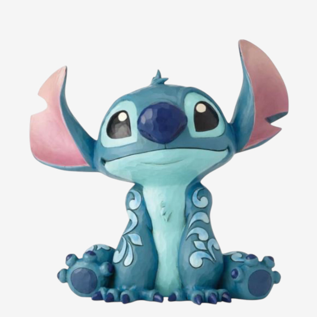 Once Upon Magic Disney Traditions by Jim Shore blue Stitch figurine with folk art details and pink inner ears, sitting pose.