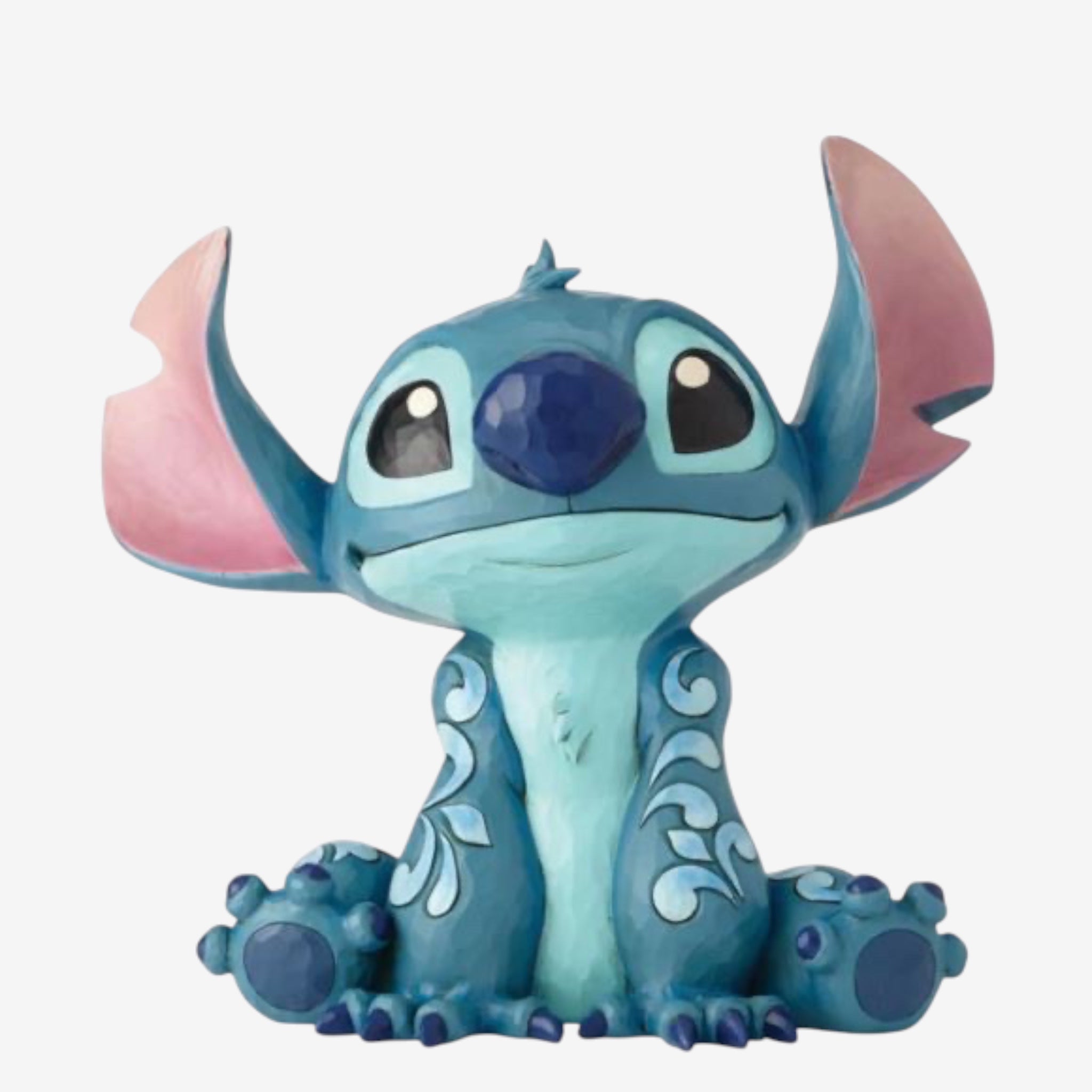 Once Upon Magic Disney Traditions by Jim Shore blue Stitch figurine with folk art details and pink inner ears, sitting pose.