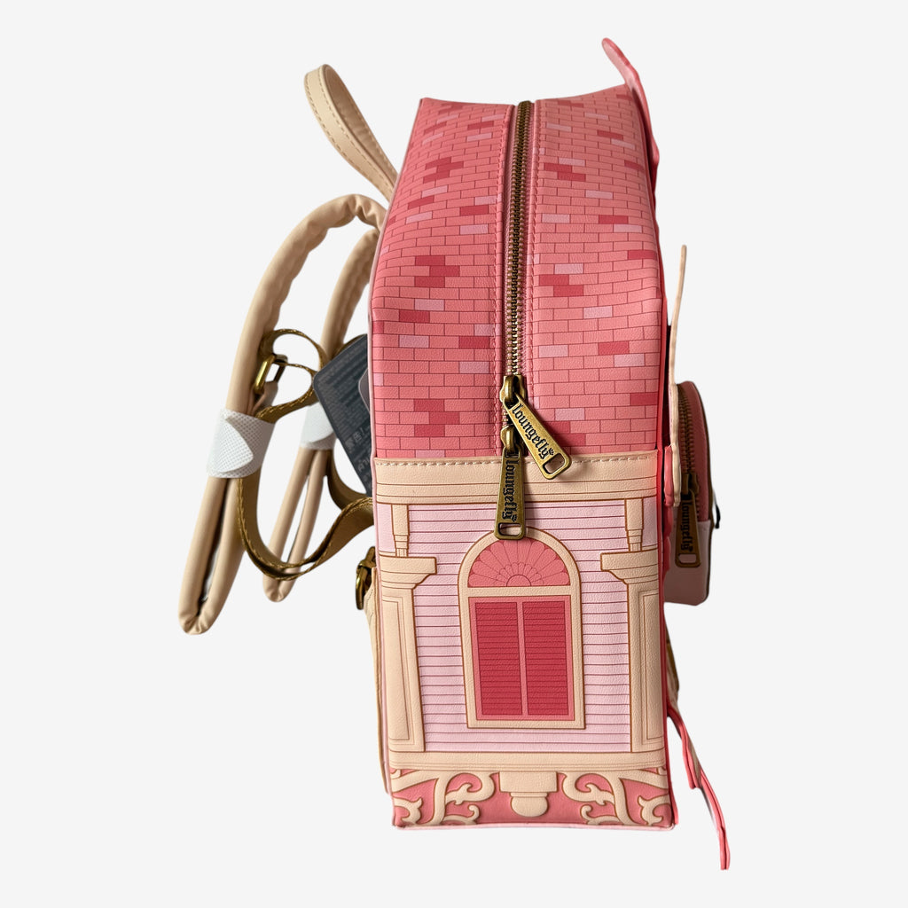 Once Upon Magic pink faux leather backpack shaped like a clock tower, inspired by Disneyland Hotel architecture, with Mickey Mouse details.