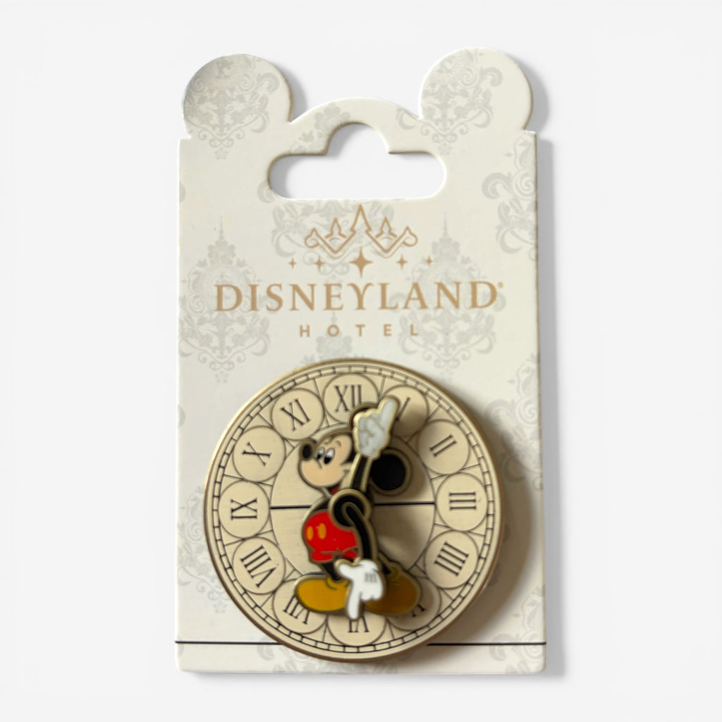 Once Upon Magic Disneyland Hotel exclusive pin featuring Mickey Mouse on a clock face with Roman numerals, made of enamel and metal.