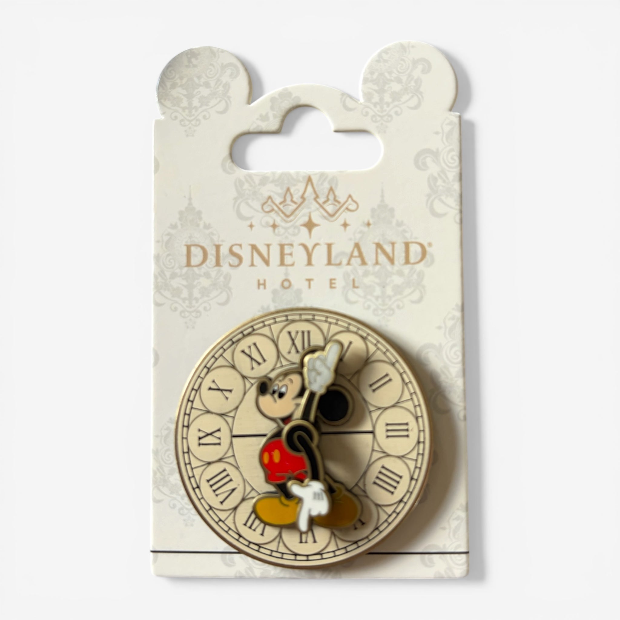 Once Upon Magic Disneyland Hotel exclusive pin featuring Mickey Mouse on a clock face with Roman numerals, made of enamel and metal.