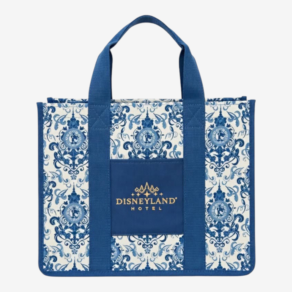 Once Upon Magic Disneyland Hotel tote bag in royal blue and white canvas with baroque floral motifs and Cinderella silhouette. Gold embroidered logo.