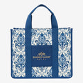 Once Upon Magic Disneyland Hotel tote bag in royal blue and white canvas with baroque floral motifs and Cinderella silhouette. Gold embroidered logo.