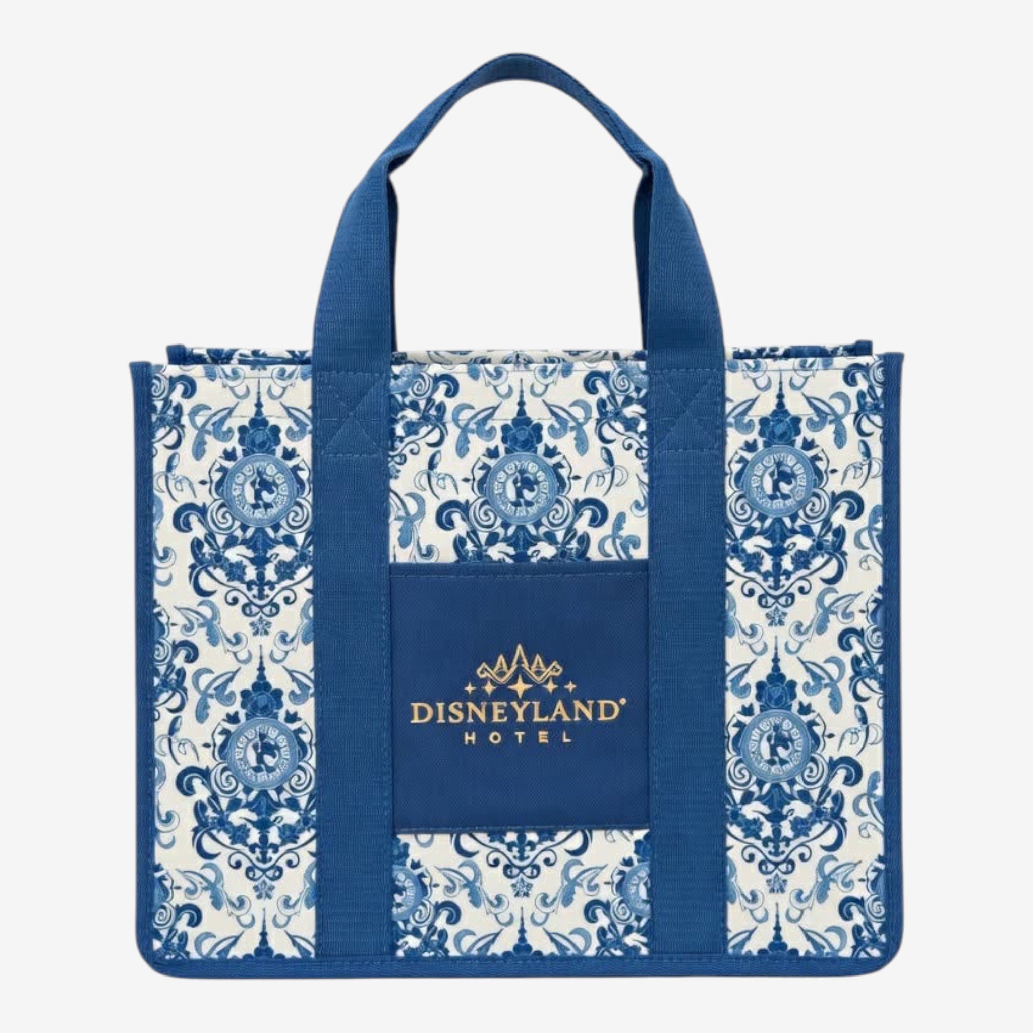 Once Upon Magic Disneyland Hotel tote bag in royal blue and white canvas with baroque floral motifs and Cinderella silhouette. Gold embroidered logo.