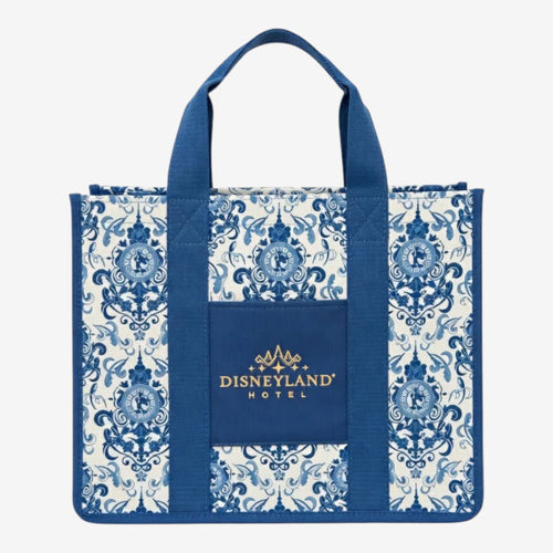 Once Upon Magic Disneyland Hotel tote bag in royal blue and white canvas with baroque floral motifs and Cinderella silhouette. Gold embroidered logo.